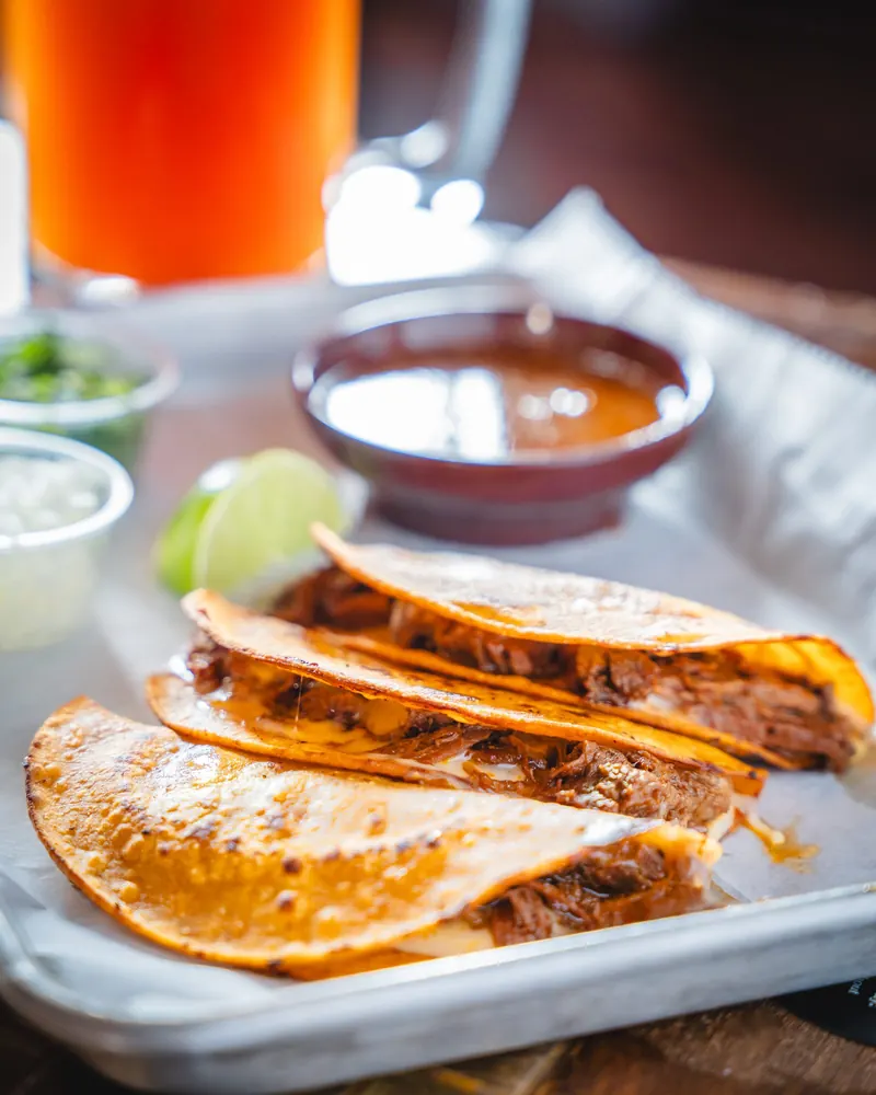 Birria tacos with consomé
