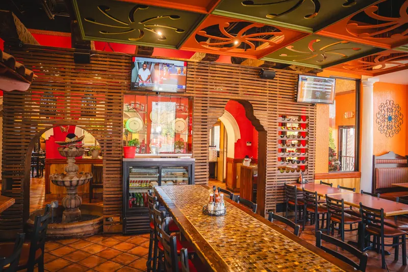 Monroe bar under a carved wood ceiling