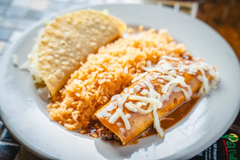 Speedy Gonzales: a hard taco, an enchilada and rice