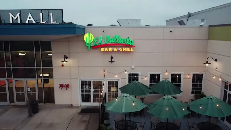 El Vallarta Bar and Grill Concord patio with green umbrellas and string lights
